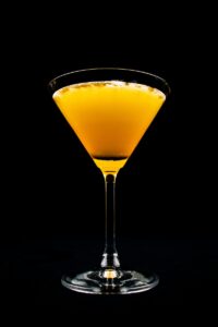 clear drinking glass with yellow liquid