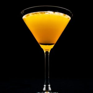 clear drinking glass with yellow liquid